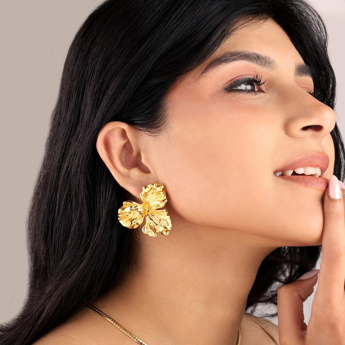 Wildflower Stud Earrings - model shot, gold flower stud earrings worn by Sucra