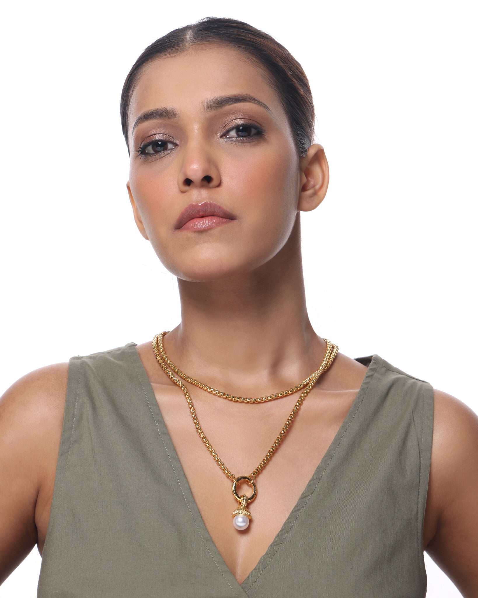 Woman wearing Lumi Pearl Necklace — 14K gold-plated necklace with a freshwater pearl. Sucra Luxe.
