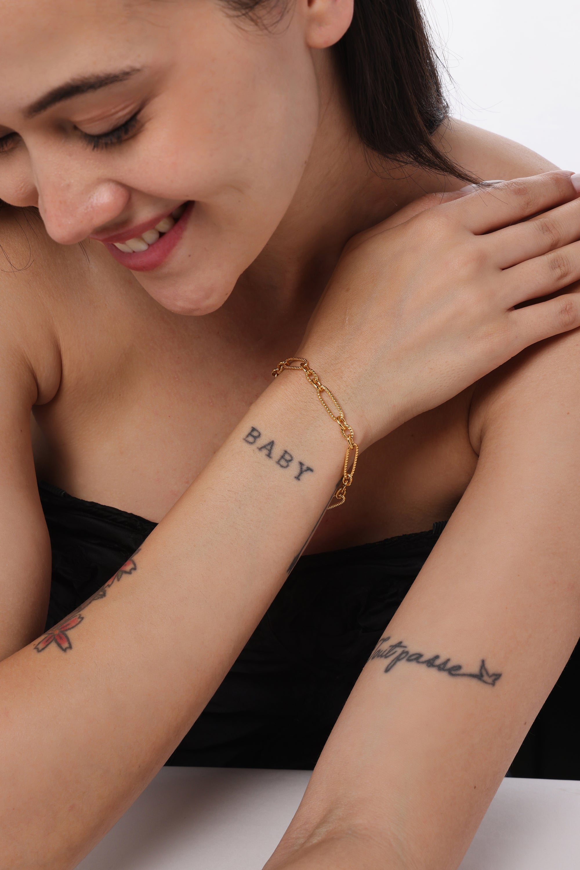 Textured Paperclip Chain Bracelet — model shot, 14K gold-plated recycled brass bracelet by Sucra