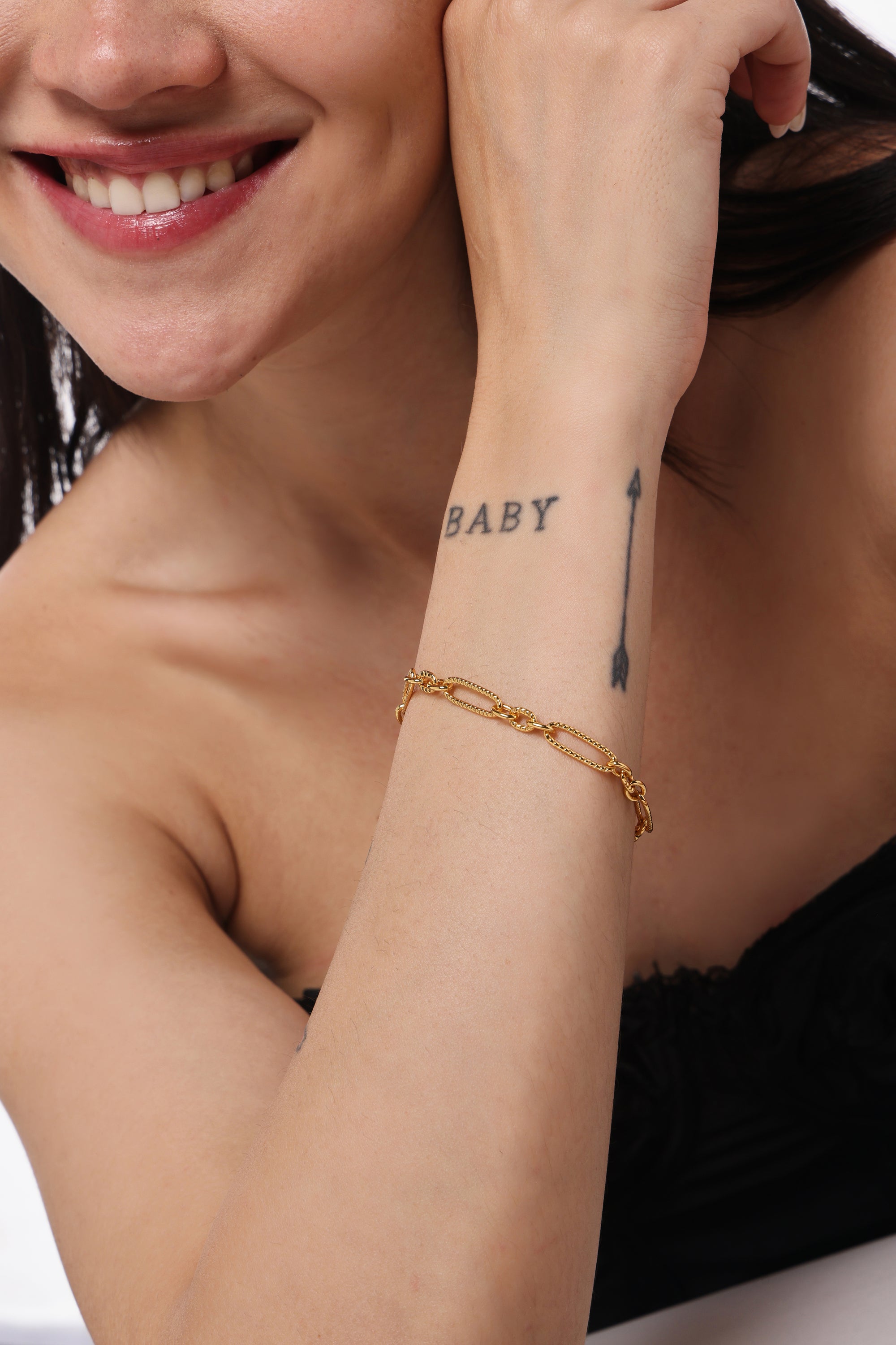 Textured Paperclip Chain Bracelet — model shot, 14K gold-plated recycled brass bracelet by Sucra