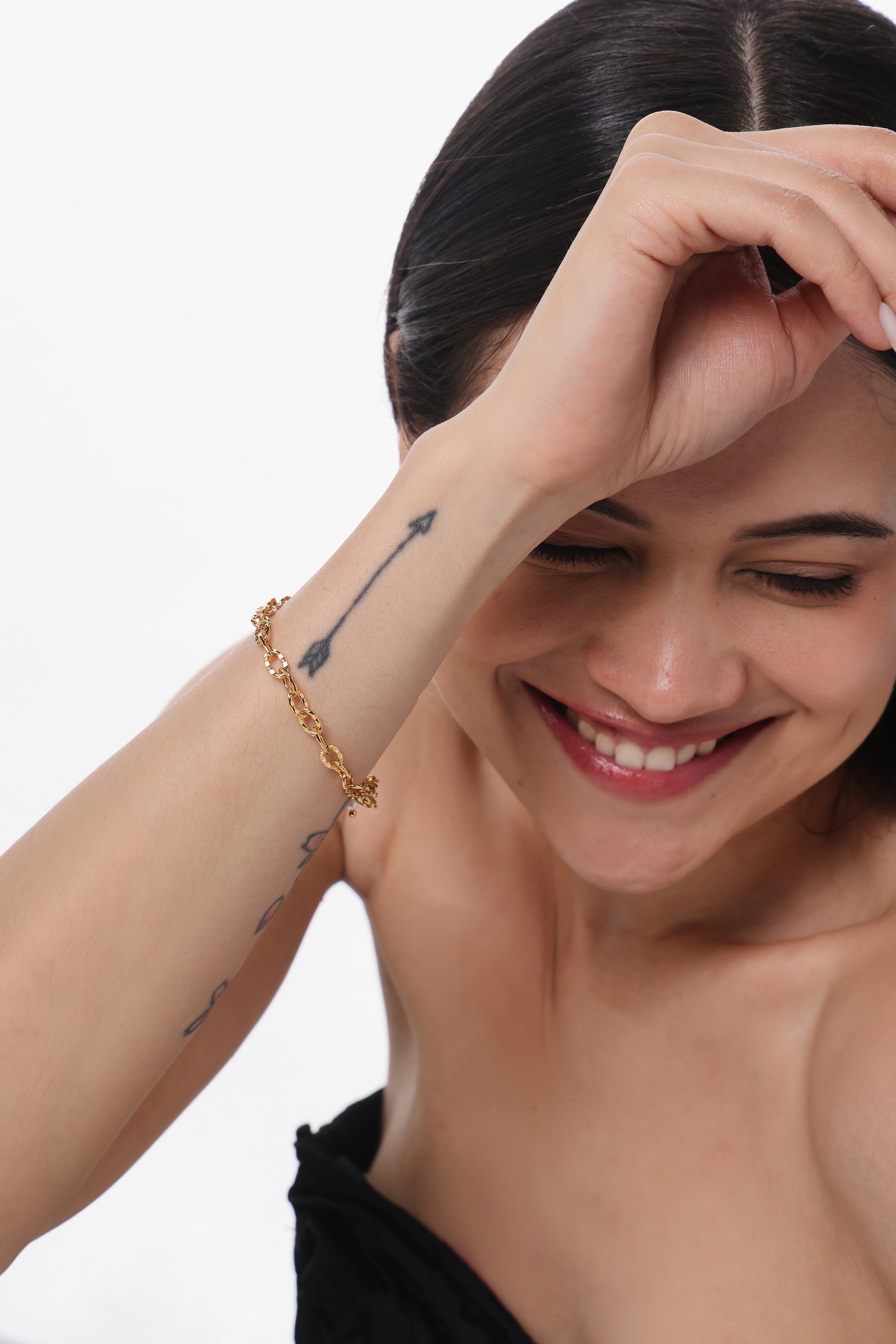 Textured Oval Link Bracelet — model shot, 14K gold-plated recycled brass bracelet by Sucra